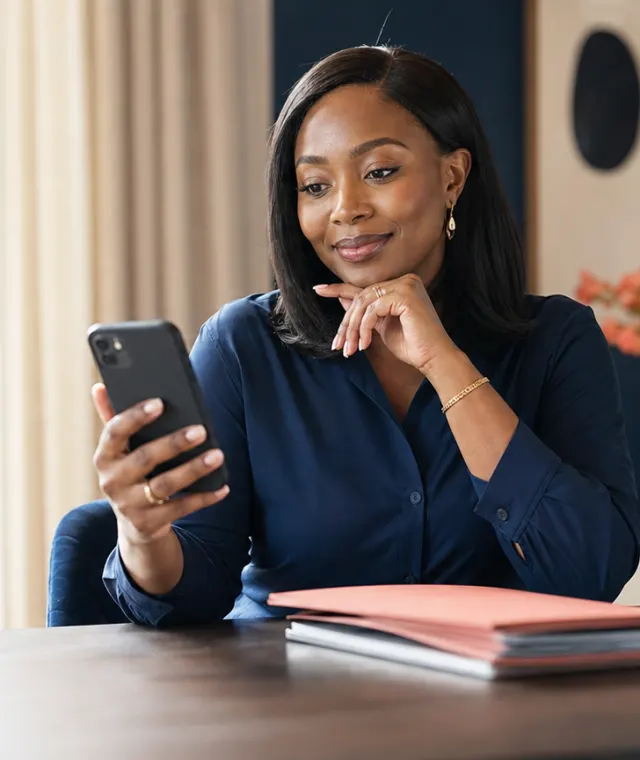 A customer checking her insurance on her phone